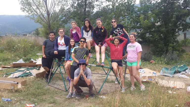 SERVICE Armenia participants complete assembly of one of two play structures.