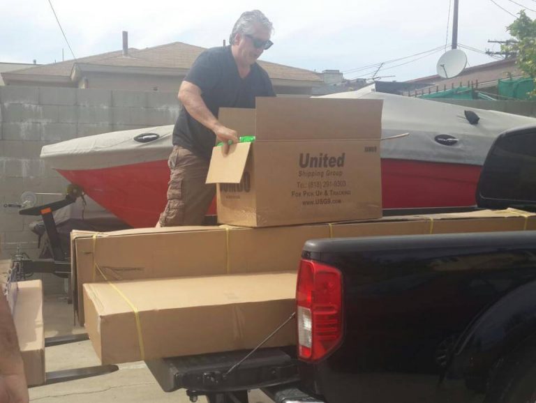 Executive Director, Peter Abajian, getting the playground parts ready for shipment.