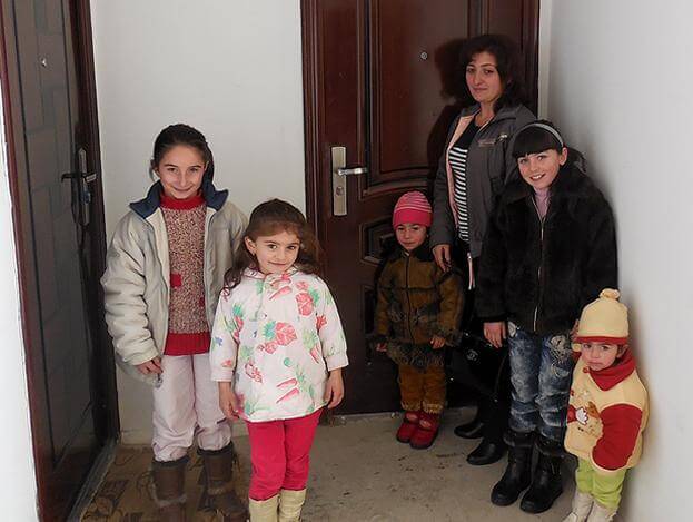The-Poghosyan-Family-after-receiving-their-new-home.