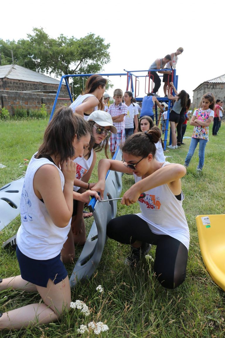 SERVICE Armenia 2017 participants working together to assemble a playground for the children in the village of Tsoghamarg.