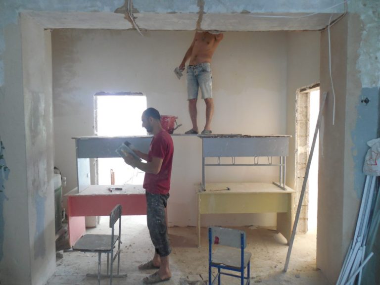 The construction crew working on the hallway at the Zorakan School.