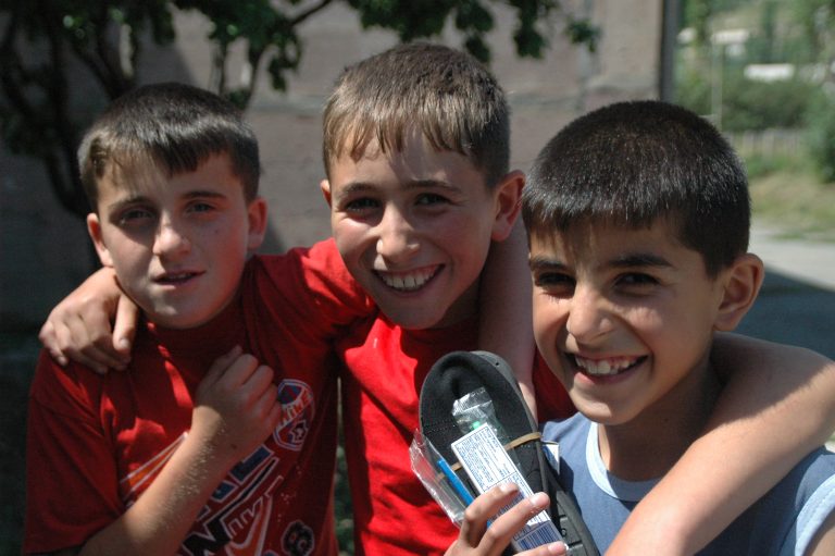 Happy kids after receiving their dental supplies in 2013.