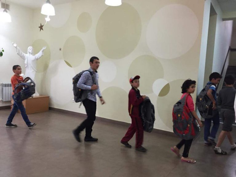 Back to class with their new backpacks.