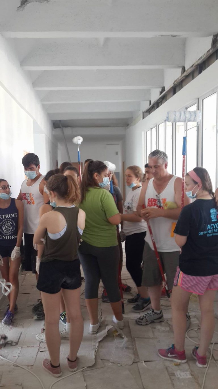 SERVICE Armenia 2015 participants receive their supplies to begin the day's priming work.