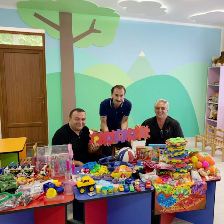 The Paros team couldn't help but play with the toys they were delivering to the brand new Baghanis Kindergarten weeks prior 
to the first day of school.