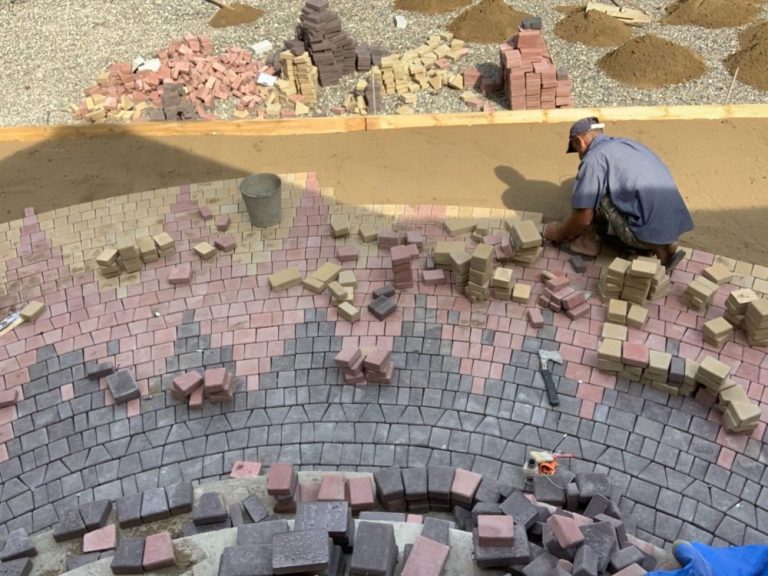 Crew members meticulously assembling the exterior flooring.