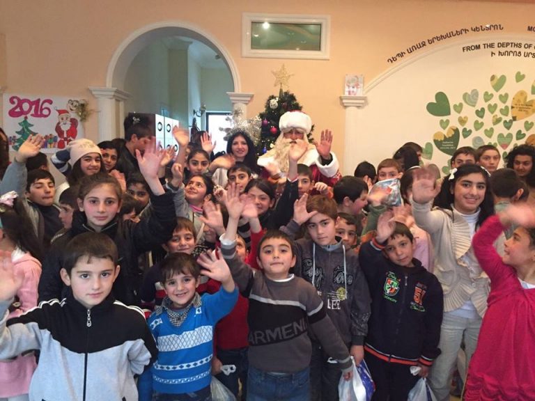 The children and Santa enjoying their Christmas party.