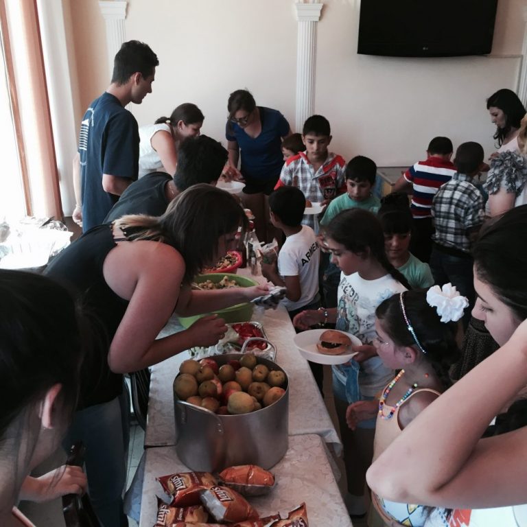 Getting their food at the First Annual Carnival hosted by SERVICE Armenia 2015 participants and Paros staff.