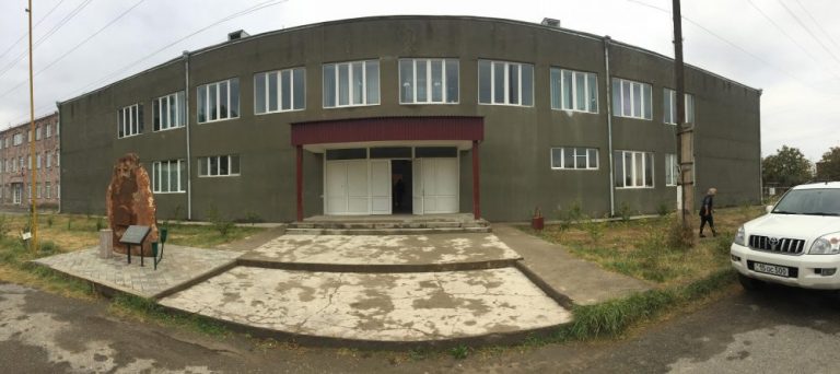 A panorama photo of the completed exterior of the Hatsik village school.