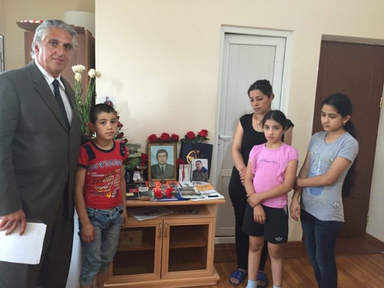 Adam Arushamyan's widow and his three children in Stepanakert with Executive Director, Peter Abajian.
