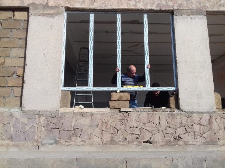 New windows being installed in the auditorium at the Hatsik School.