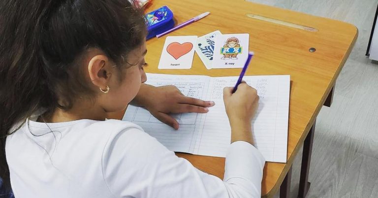 Working hard during her English language class.
