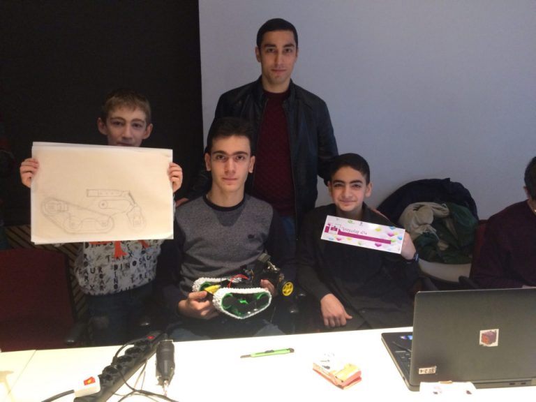 Students from the Ghoghanj Team presenting their award winning 3-D plan at the Union of Information Technology Enterprises 3-D Modeling contest.