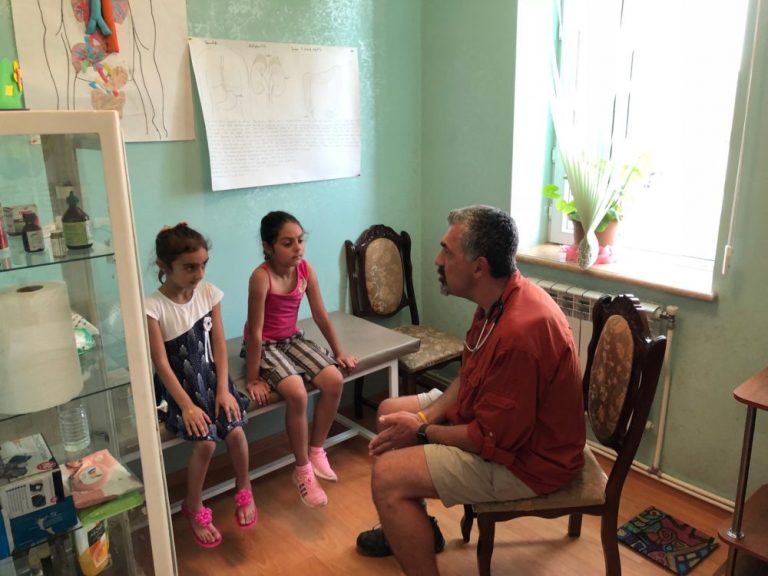Dr. Deramerian examining the children at Debi Arach, during the first Med-Aid ARMENIA mission.