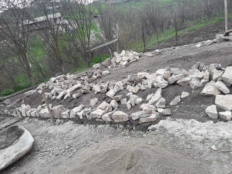 Work on the barn's foundation is progressing.