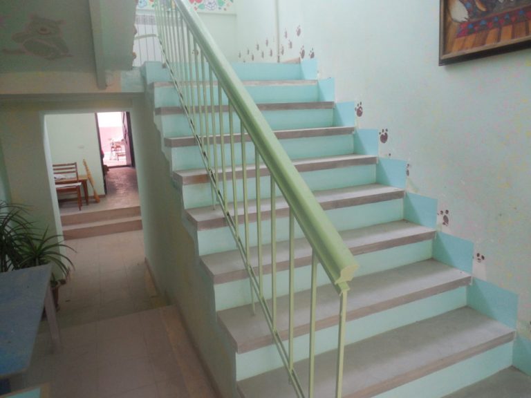 The old staircase at the kindergarten in Paravakar was dangerous for the children and staff to use.  New, level, stair treads dramatically improved safety.
