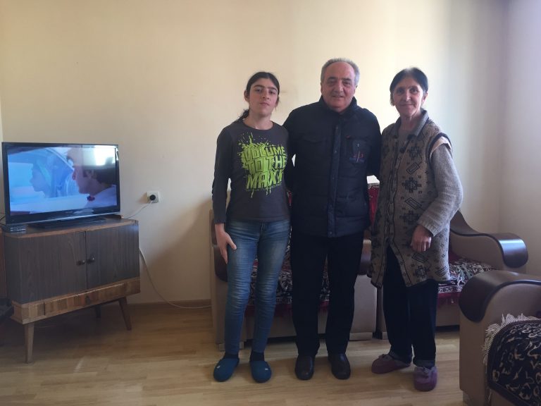 Paros Project Manager Gegham Minasyan with the Yeghiazaryan Family in their new apartment.