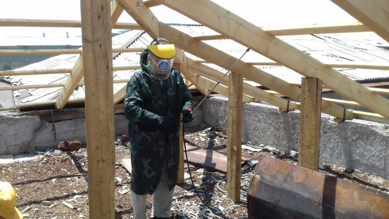 Our construction team leader sprayed the wooden structure to protect against rot and insects.