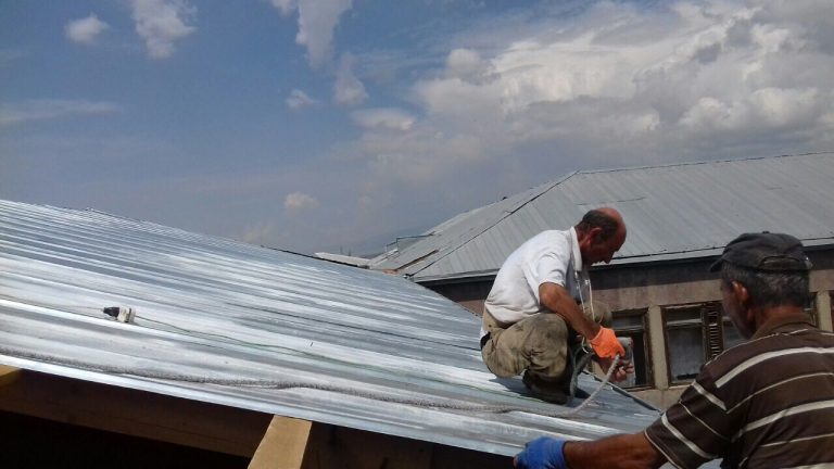 Working three stories above the ground in the heat proved a challenge for our team.
