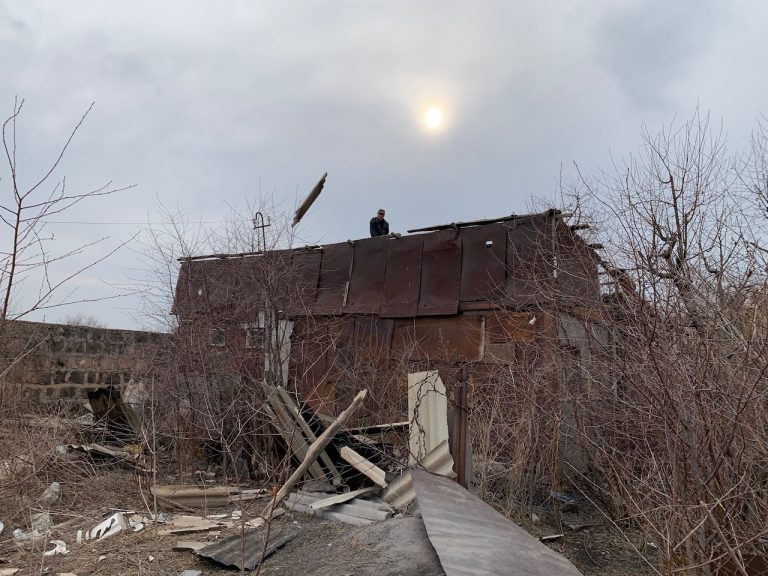 Immediately following the move, a work crew from the Shirak Center NGO begins the process of demolishing the Sargsyan's old domik to ensure no one will ever live in it again.