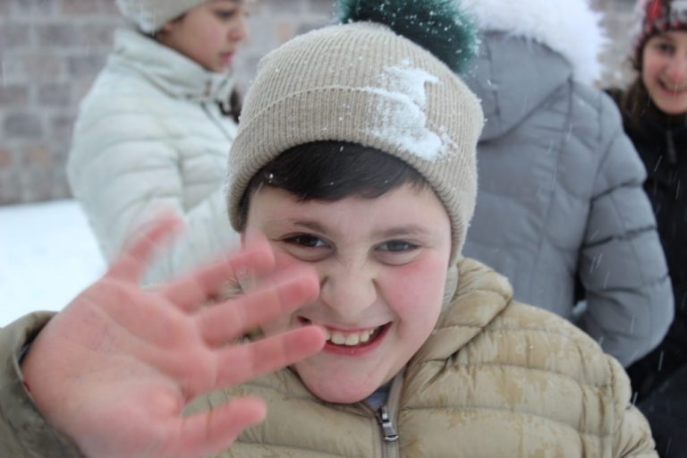 Positive childhood experiences are really important for our students, and what better than a snow ball fight with friends and teachers !!