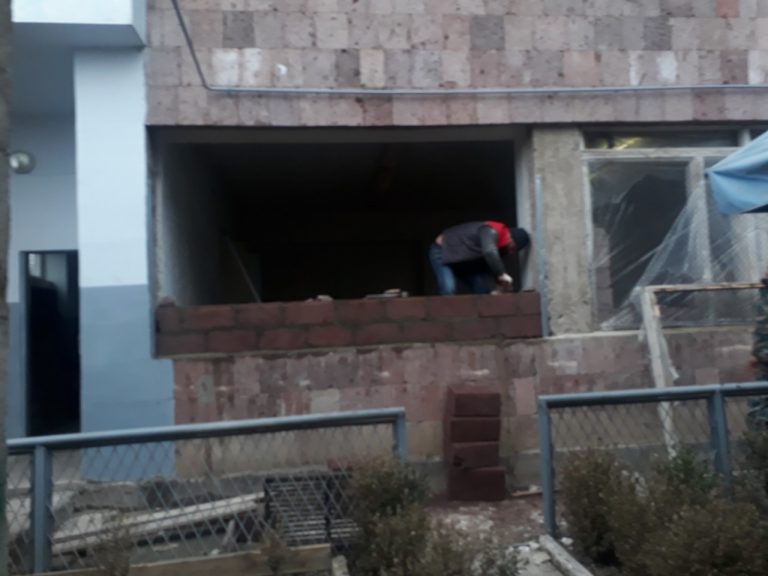 The large first floor windows being blocked smaller to provided added security for the Emergency Situations Ministry Unit stationed in Nerkin Karmir Aghbyur.
