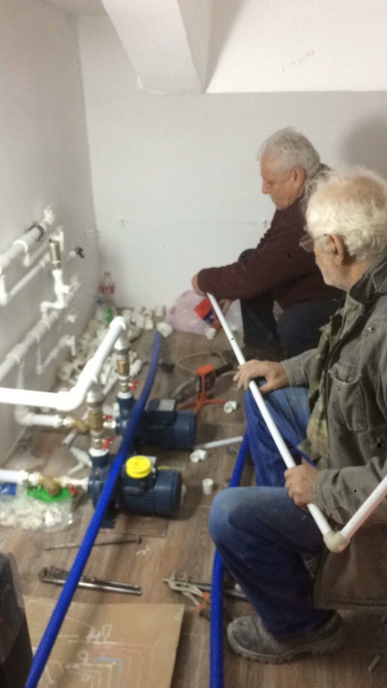 Paros Foundation heating specialist installed a new electric boiler, new piping and radiators throughout the building, and refurbished and attached the existing solar heating system to assist with the heating bills.