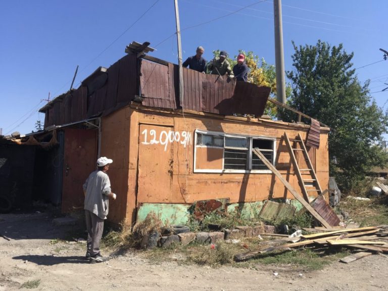 Shirak Center NGO's demolition crew starting the tear down of the Sahakyan's old domik.