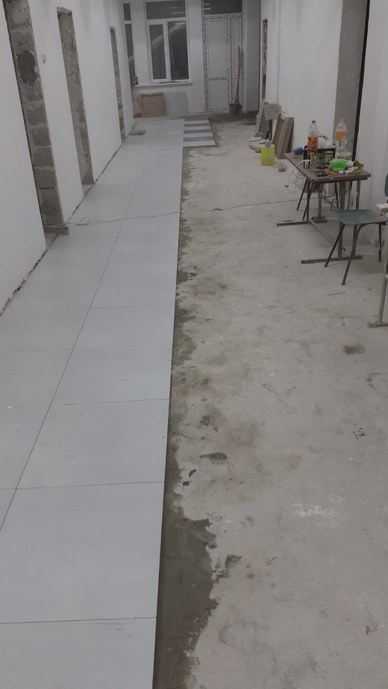 Work on the hallway flooring continues at the Nerkin Karmir Aghbyur School.