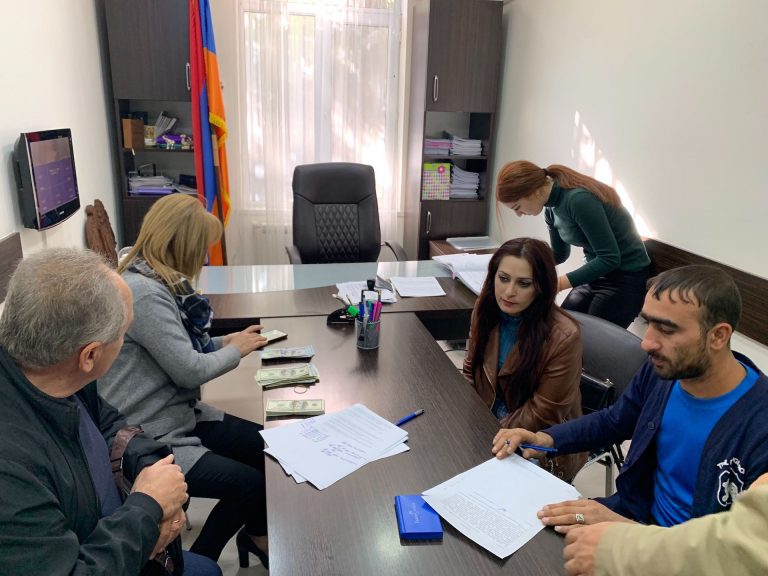 The Tovamasyan Family at the Notary Office preparing to sign their purchase contract.