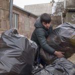 Students help load recycling materials onto the truck bound for Yerevan's recycling center.