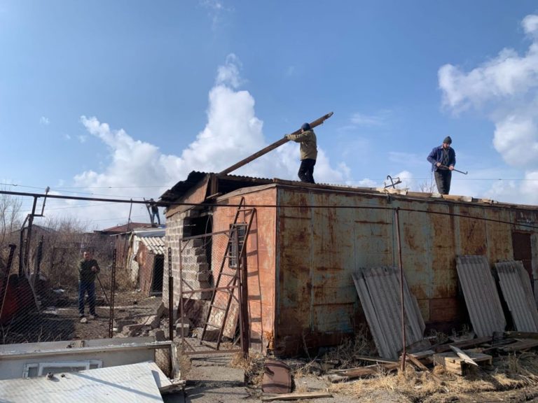 Shirak staff members dismantling the Nalbandyan's old home.