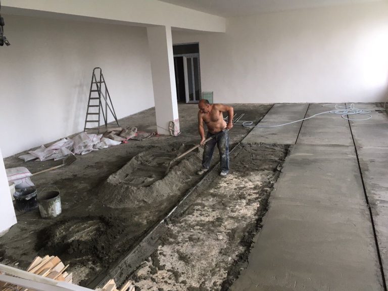 A cement subfloor was installed to correct the uneven flooring.