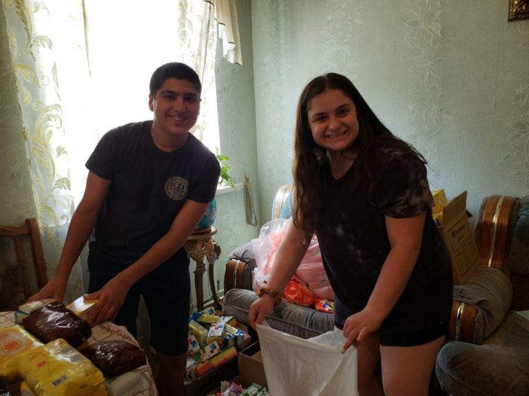 SERVICE Armenia 2019 assembling food packs for families in need in Gyumri.