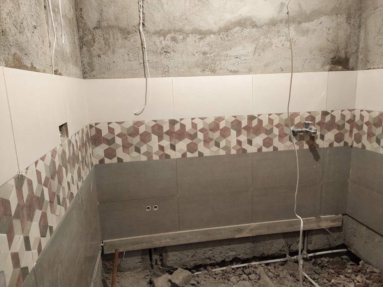 Suren's home did not have a functioning bathroom or sewer system prior to the reconstruction.  The family is excited for an indoor restroom.