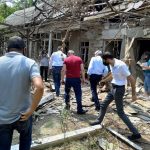 Inspecting homes damaged by Azeri attacks.
