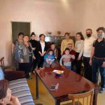 Paros team Members Armen Simonyan and Peter Barsamian visit one of the multigenerational families who fled fighting in Artsakh.