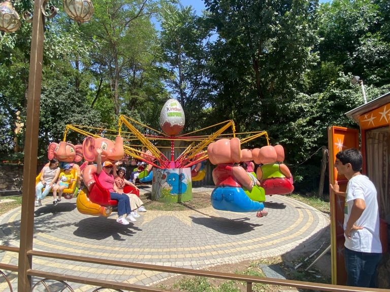 SERVICE Armenia 2022 participants and they buddies from the Kharpert Home enjoying the rides at Victory Park.
